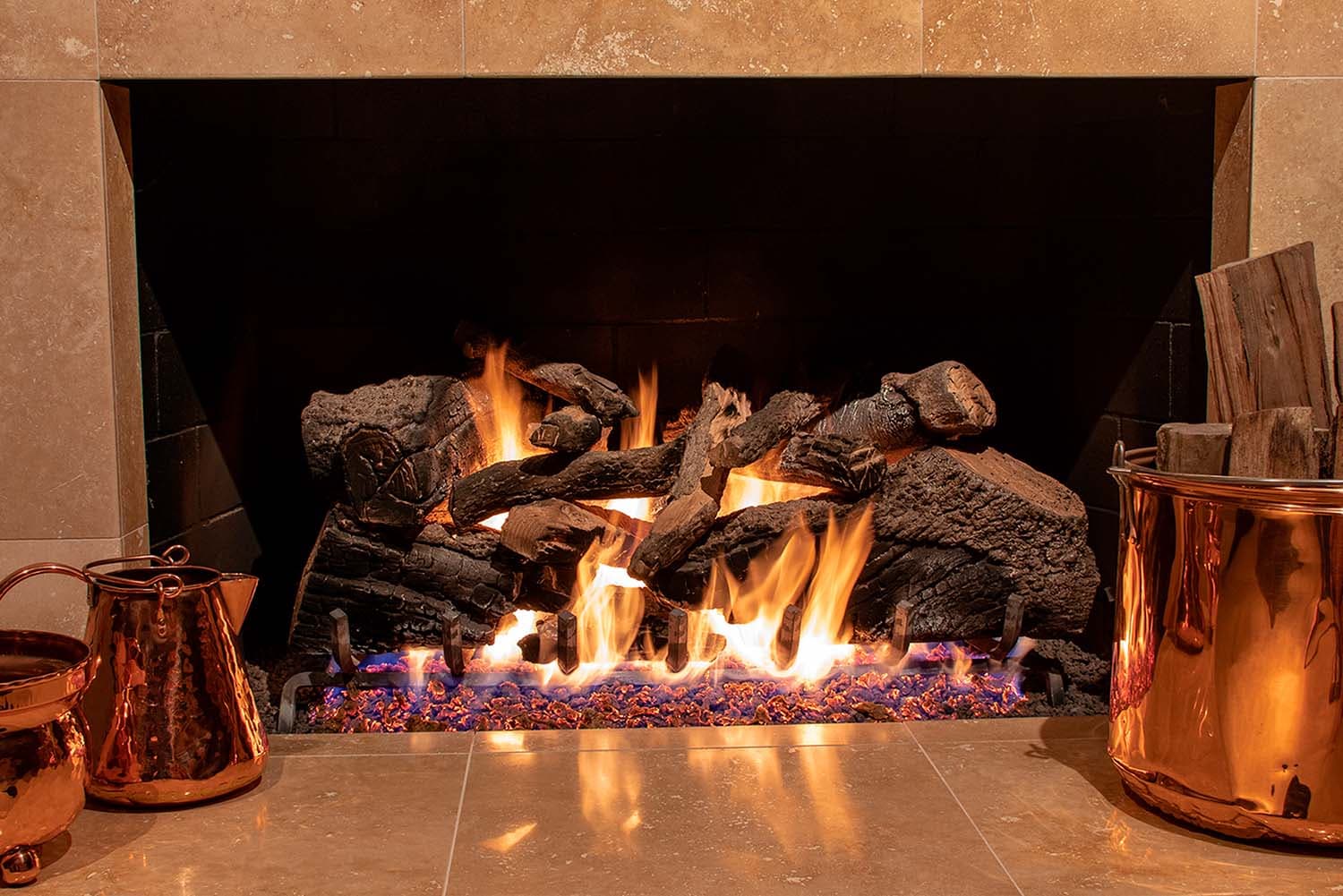 Elegant gas fireplace with custom masonry by Nevermore Services